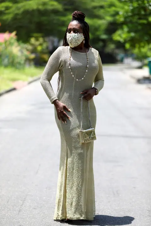 Nigerian fashion stylist Sefiya Diejomoah, 35, poses for a picture with a blinged-out face mask on, with colours matching her clothes, following the spread of the coronavirus disease (COVID-19) in Lagos, Nigeria May 14, 2020. REUTERS/Temilade Adelaja