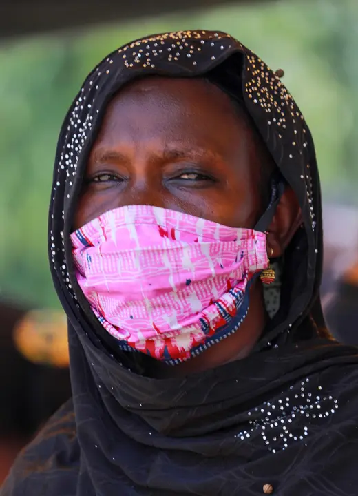 A woman wearing an hijab poses for a picture with a fabric face mask on, following the spread of the coronavirus disease (COVID-19) in Abuja, Nigeria May 14, 2020. REUTERS/Afolabi Sotunde