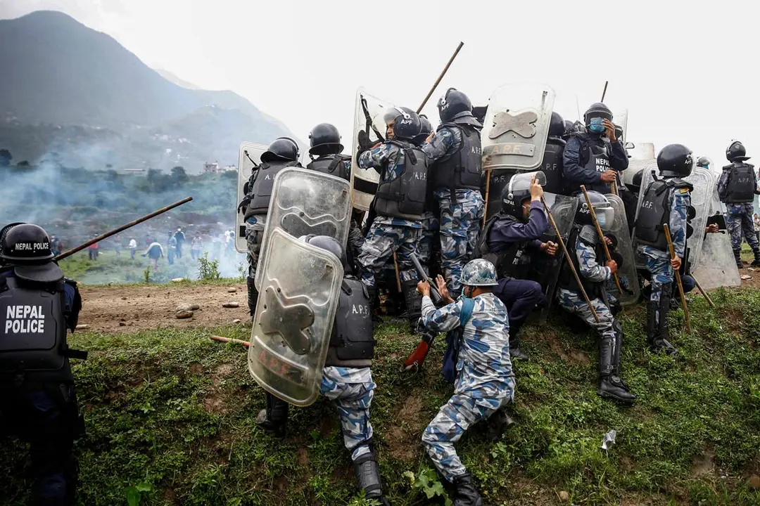 People calsh with policemen during a protest against the construction of a 76.2-kilometre-long Fast-track express railway that runs from Khokana of Lalitpur. Photo: Skanda Gautam/ZUMA Wire/dpa