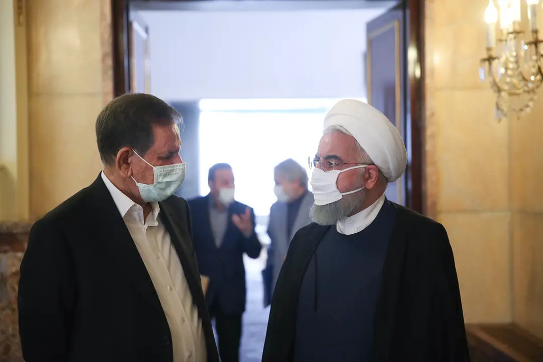 Iranian President Hassan Rouhani (R) talks to First Vice President Eshaq Jahangiri after the government economic coordination headquarters meeting. Photo: Iranian Presidency/dpa.