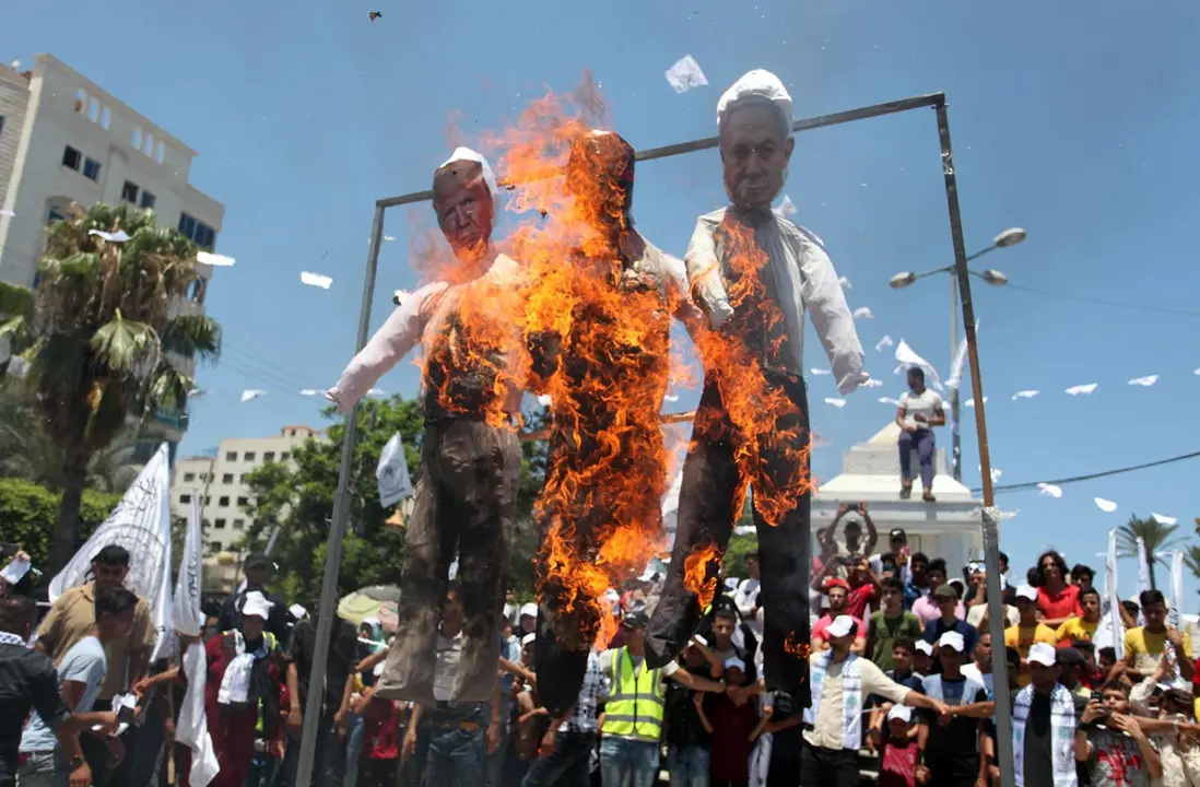 Palestinian Territories, Gaza: Palestinian supporters of al-Ahrar movement burn effigies depicting (L-R) US President Donald Trump, Trump&#39;s Middle East peace plan dubbed as the &#34;Deal of the Century&#34;, and Israeli Prime Minister Benjamin Netanyahu as they take part in a march marking the 13th anniversary of its founding, and protest against the Israeli annexation plan that will occupy about 30 percent of the West Bank area. Photo: Mahmoud Ajjour/APA Images via ZUMA Wire/dpa