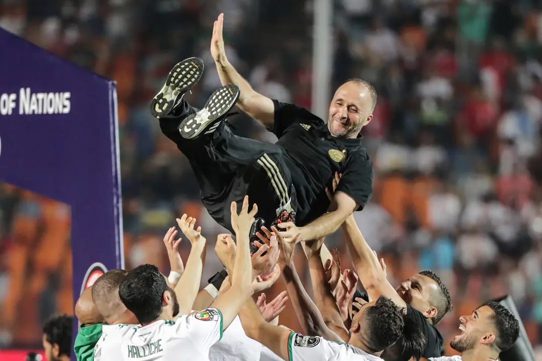 Egypt, Cairo: Algeria players toss Algeria&#39;s national team coach Djamel Belmadi (top) as they celebrate winning the 2019 Africa Cup of Nations final soccer match between Senegal and Algeria at the Cairo International Stadium. Djamel Belmadi confirmed that he will never forget the feeling of crowning the title of the 2019 African Nations Cup, held in Egypt, and carried the cup to Algeria. Photo: Oliver Weiken/dpa