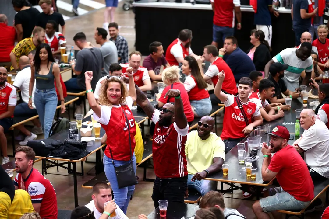 London: Fans cheer at Box Park Wembley in London to watch the FA Cup final soccer match between Arsenal and Chelsea, taking place at Wembley Stadium. Photo: Yui Mok/dpa.