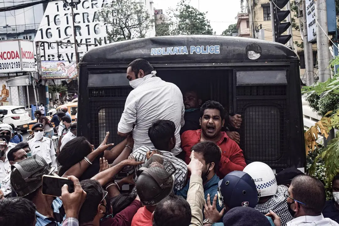 Kolkata (India): A demonstrator chants slogans as he is being detained by Kolkata police during a protest against the educational decision which was taken by the Government. Photo: Tamal Shee/dpa.