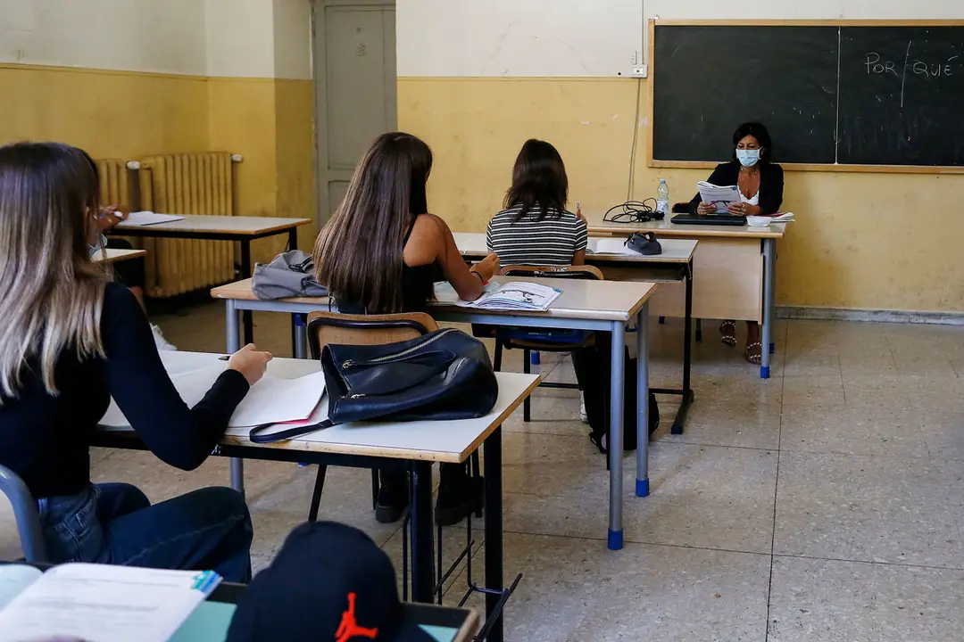 07 September 2020, Italy, Rome: Students maintain their social distancing as sit inside a classroom at Cornelio Tacito high school during the first day of 2020-2021 school year. Photo: Cecilia Fabiano/dpa.