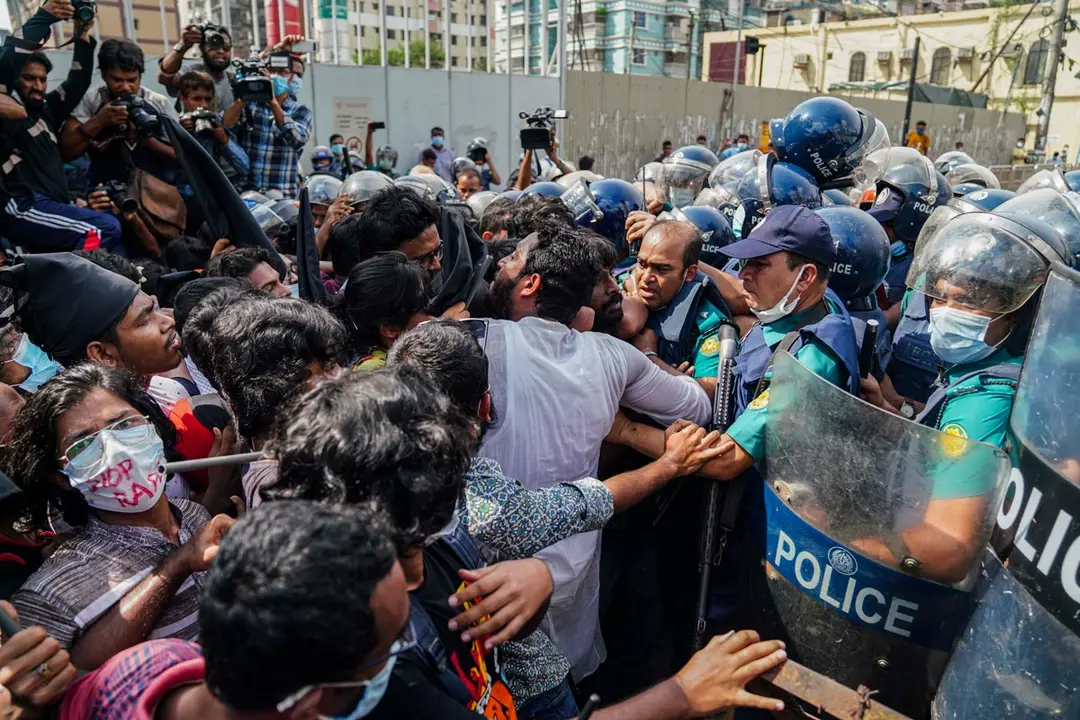 06 October 2020, Bangladesh, Dhaka: People skirmish with policemen during a protest to call for justice after a video surfaced showing a group of men stripping and severely beating a woman in the southern district of Noakhali. Photo: Zabed Hasnain Chowdhury/dpa.