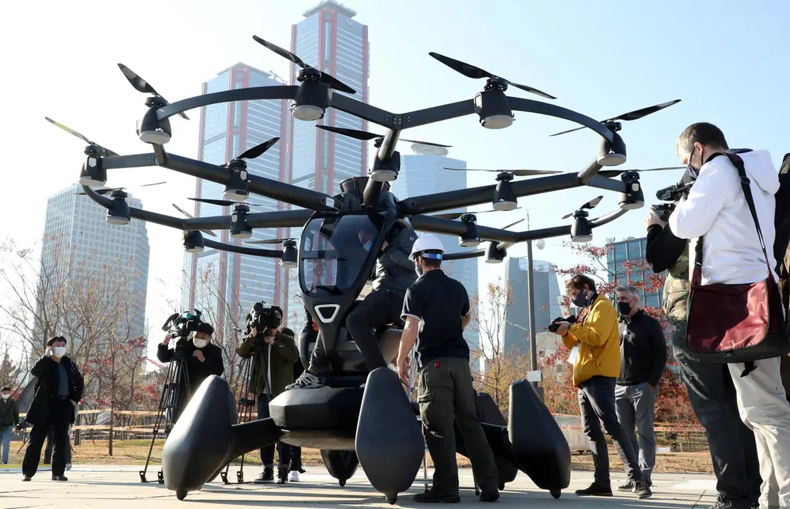 11 November 2020, South Korea, Seoul: A man gets in a drone taxi during the transport ministry&#39;s event to test an unmanned air taxi service as part of South Korea&#39;s roadmap for the commercialization of urban air mobility by 2025. Photo: -/YNA/dpa
