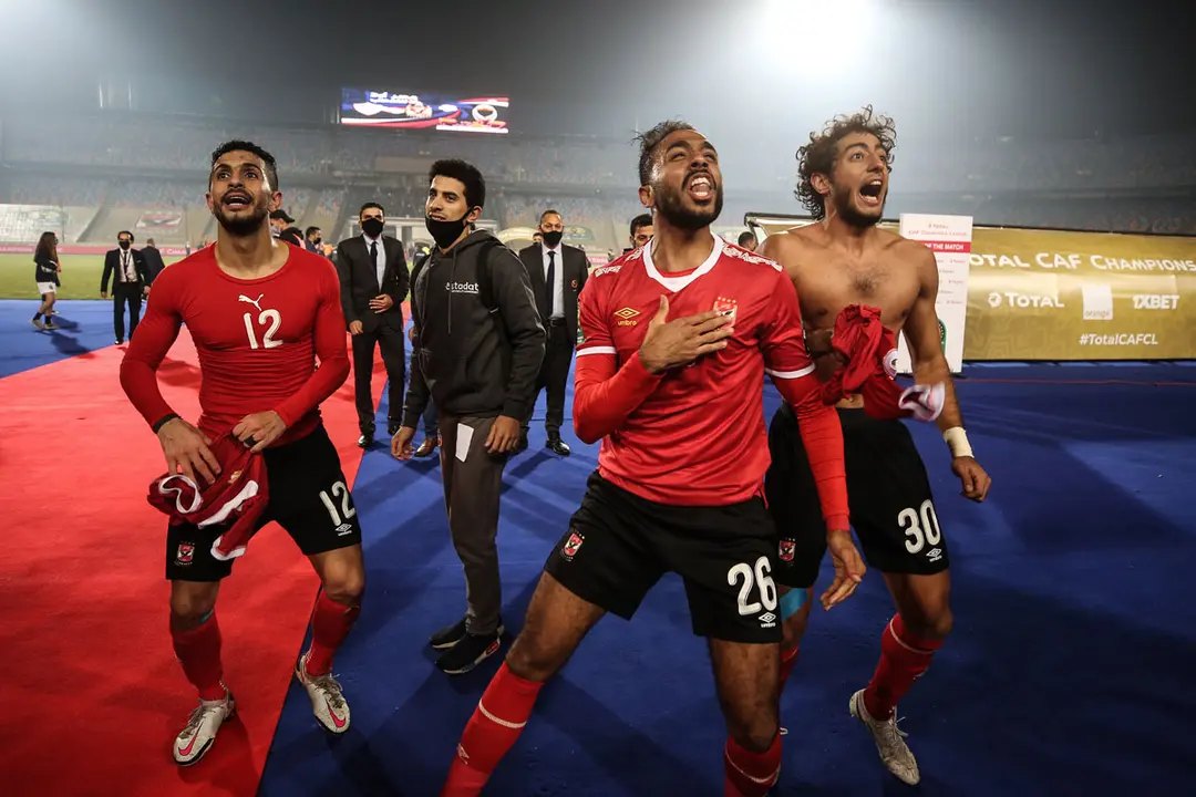 27 November 2020, Egypt, Cairo: (L-R) Al Ahly's Ayman Ashraf, Kahraba and Mohamed Hany celebrate after winning the African Champions League Final soccer match against Zamalek at Cairo International Stadium. Photo: Sameh Abo Hassan/dpa