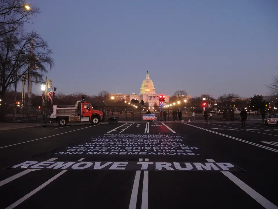 13 January 2021, US, Washington: Anti-Trump protesters put a big "Remove Trump" banner on the street in front of the US Capitol. The House of Representatives is expected to vote to impeach the US President Donald Trump after Vice President Mike Pence declined to use the 25th amendment to remove him from office after protestors breached the US Capitol last week. Photo: Lena Klimkeit/dpa.
