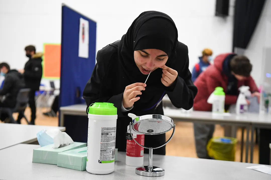 08 March 2021, United Kingdom, London: A student takes a Lateral Flow Test at Hounslow Kingsley Academy as pupils in England return to school for the first time in two months as part of the first stage of lockdown easing. Photo: Kirsty O'connor/PA Wire/dpa