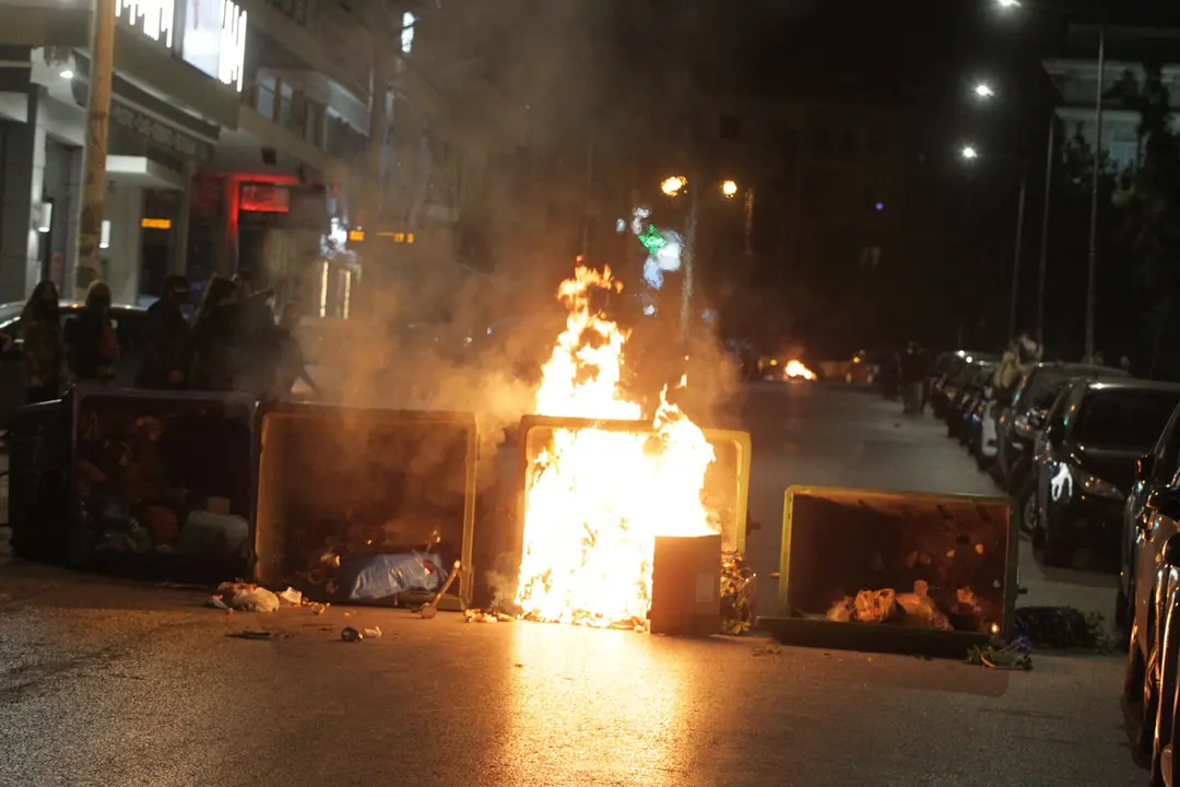 09 March 2021, Greece, Athens: Garbage cans burn during a protest against the police violence. Photo: Aristidis Vafeiadakis/ZUMA Wire/dpa