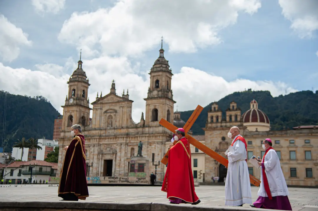 02 April 2021, Colombia, Bogota: Archbishop of Colombia, Monsignor Jose Luis Rueda, followed by priests and traditional presidential guards, take part in the Way of the Cross Procession ''Viacrusis'' at empty plaza de Bolivar. The event was transmitted live through public Colombian Television to prevent the spread of the Coronavirus pandemic. Photo: Chepa Beltran/VW Pics via ZUMA Wire/dpa
