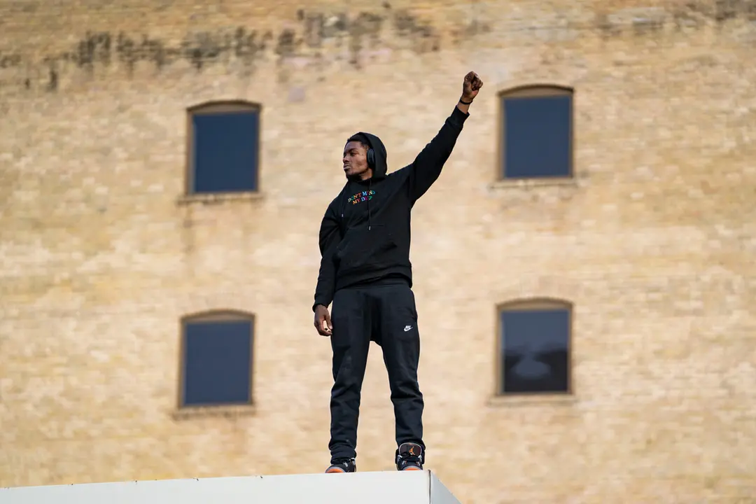 20 April 2021, US, Minneapolis: A Black Life Matter activist reacts quietly with his fist in the air after Derek Chauvin, the former US police officer accused in the killing of Floyd, has been found guilty on all three counts. Photo: Dominick Sokotoff/ZUMA Wire/dpa