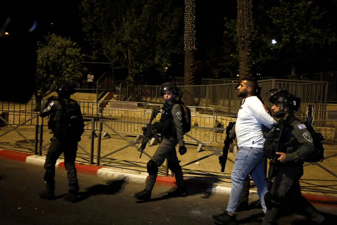 22 April 2021, ---, Jerusalem: Israeli security forces detain a Palestinian during clashes with Palestinian protesters outside the Damascus Gate in Jerusalem's Old City. Photo: Jamal Awad/APA Images via ZUMA Wire/dpa
