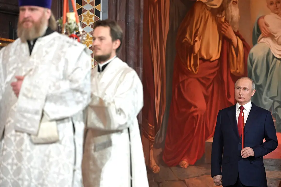 HANDOUT - 02 May 2021, Russia, Moscow: Russian President Vladimir Putin (R) attends a service at the Christ the Saviour Eastern Orthodox Cathedral on the occasion of the Orthodox Easter. Photo: -/Kremlin/dpa - ATTENTION: editorial use only and only if the credit mentioned above is referenced in full