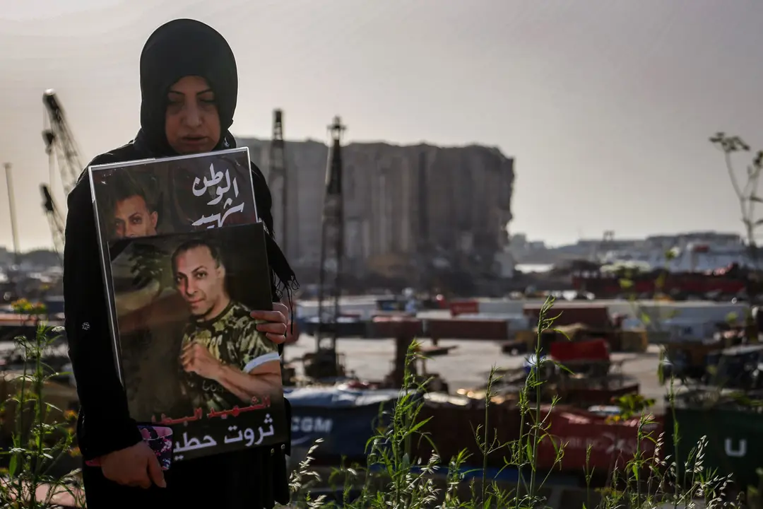 04 May 2021, Lebanon, Beirut: Mother of Tharwat Hotiet, who was killed in the 4th of August massive Beirut port explosion takes part in a ceremony outside the devastated harbour to mark nine months of the massive blast that killed at least 207 people and wounded almost 6000. Photo: Marwan Naamani/dpa