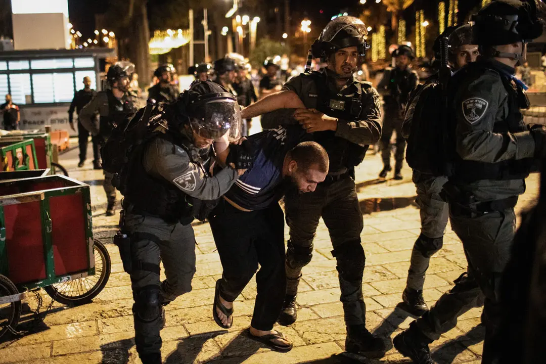 07 May 2021, Israel, Jerusalem: Israeli security forces arrest a man during a demonstration against the planned eviction process for the Palestinians in the Sheikh Jarrah neighbourhood. Photo: Ilia Yefimovich/dpa