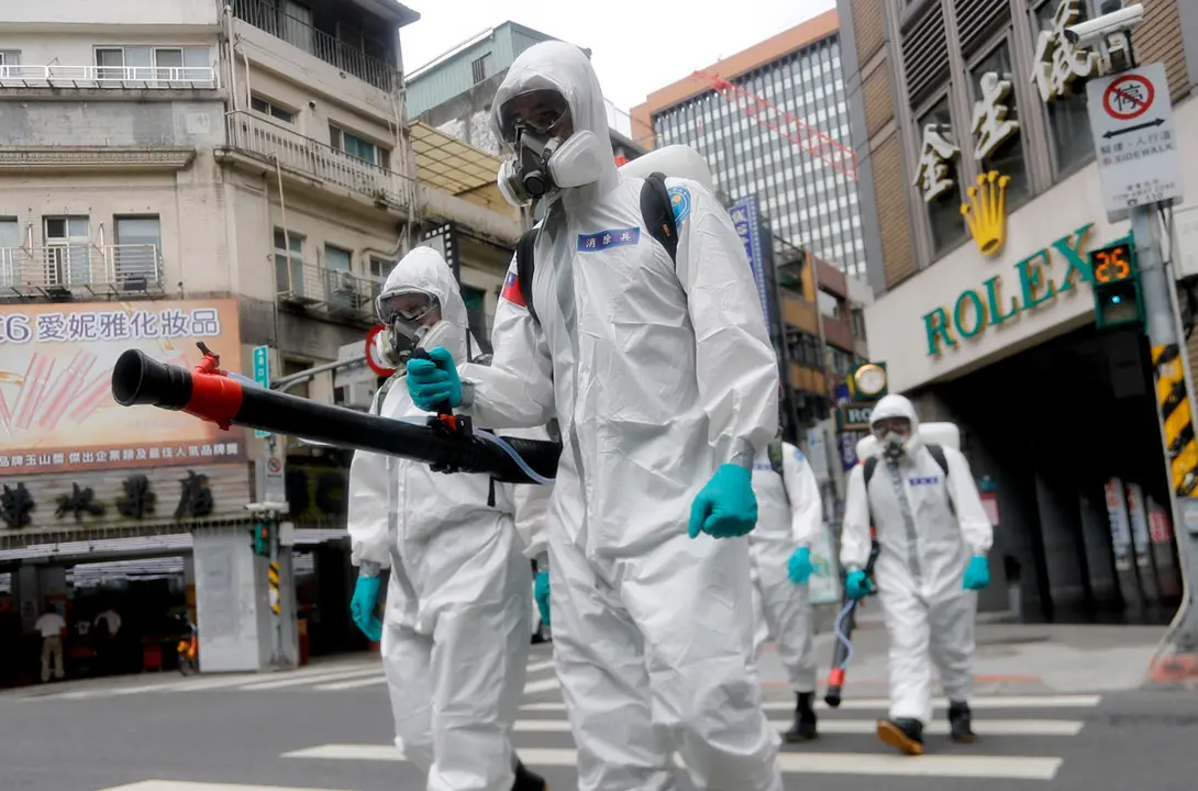 23 May 2021, Taiwan, Taipei: Military officers wearing personal protective equipment disinfect areas in Taipei, as Taiwan has seen a dramatic increase in the number of locally acquired cases. Taiwan on Sunday reported 287 new domestic cases of coronavirus, according to Taiwan Centers for Disease Control. Photo: Daniel Ceng Shou-Yi/ZUMA Wire/dpa