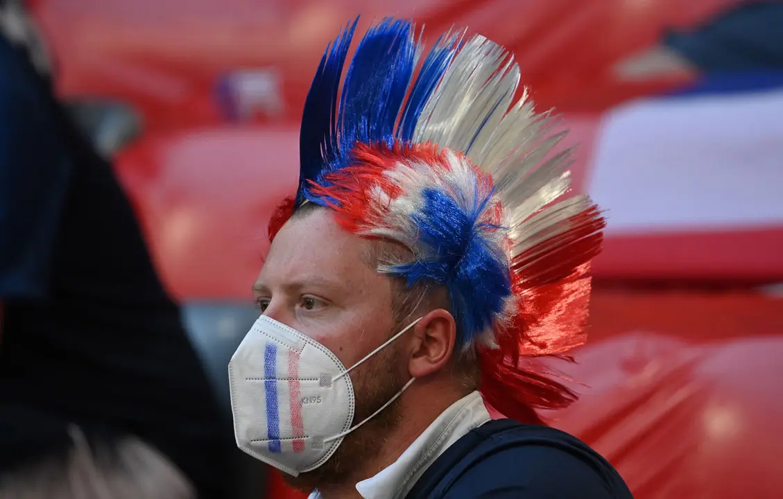 15 June 2021, Bavaria, Munich: A fan cheers in the stands before the start of the UEFA EURO 2020 Group F soccer match between France and Germany at the Allianz Arena. Photo: Federico Gambarini/dpa