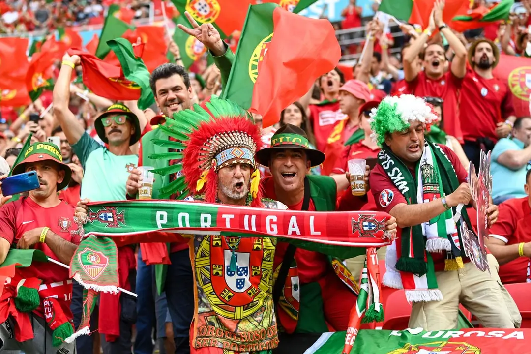 15 June 2021, Hungary, Budapest: Portugal fans cheer in the stands prior to the start of the UEFA EURO 2020 Group F soccer match between Hungary and Portugal at the Puskas Arena. Photo: Robert Michael/dpa-Zentralbild/dpa