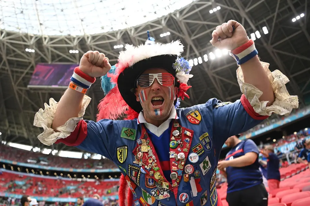 19 June 2021, Hungary, Budapest: A France fan cheers in the stands prior to the start of the UEFA EURO 2020 Group F soccer match between Hungary and France at the Puskas Arena. Photo: Robert Michael/dpa-Zentralbild/dpa.