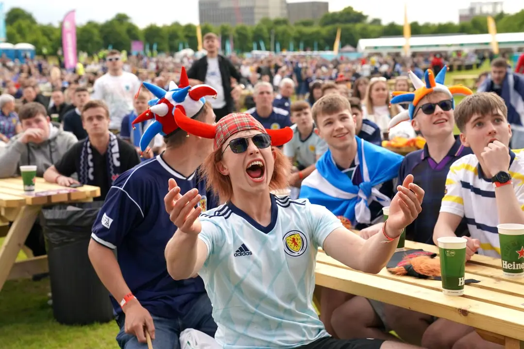 18 June 2021, United Kingdom, Glasgow: Fans watch the UEFA EURO 2020 Group D soccer match between England and Scotland during a public screening at the fan zone in Glasgow. Photo: Jane Barlow/PA Wire/dpa