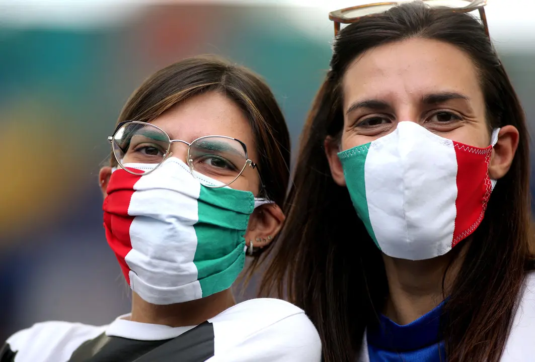20 June 2021, Italy, Rome: Italy fans sit in the stands prior to the start of the UEFA EURO 2020 Group A soccer match between Italy and Wales at the Olympic Stadium. Photo: Marco Iacobucci/PA Wire/dpa