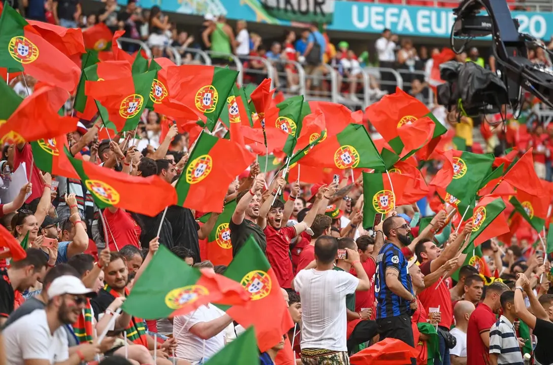 23 June 2021, Hungary, Budapest: Portugal fans cheer in the stands prior to the start of the UEFA EURO 2020 Group F soccer match between Portugal and France at the Puskas Arena. Photo: Robert Michael/dpa-Zentralbild/dpa