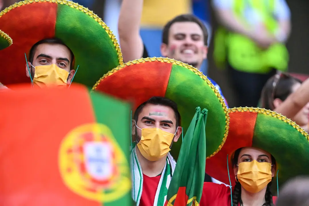 23 June 2021, Hungary, Budapest: Portugal fans cheer in the stands prior to the start of the UEFA EURO 2020 Group F soccer match between Portugal and France at the Puskas Arena. Photo: Robert Michael/dpa-Zentralbild/dpa.