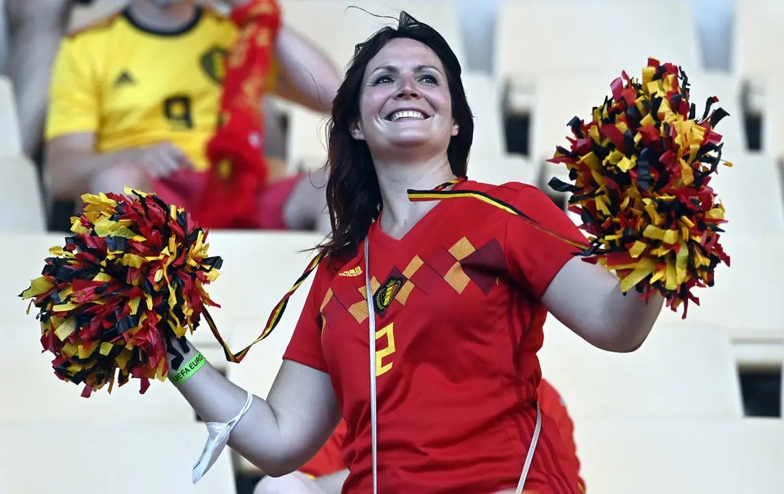 27 June 2021, Spain, Seville: A Belgium fan cheers in the stands before the start of the UEFA EURO 2020 round of 16 soccer match between Belgium and Portugal at La Cartuja Stadium. Photo: Laurie Dieffembacq/BELGA/dpa