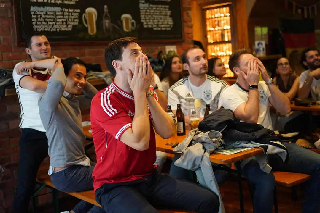 29 June 2021, United Kingdom, London: Fans watch the UEFA Euro 2020 round of 16 soccer match between England and Germany during a public screening for the match at the Octoberfest Pub. Photo: Yui Mok/PA Wire/dpa