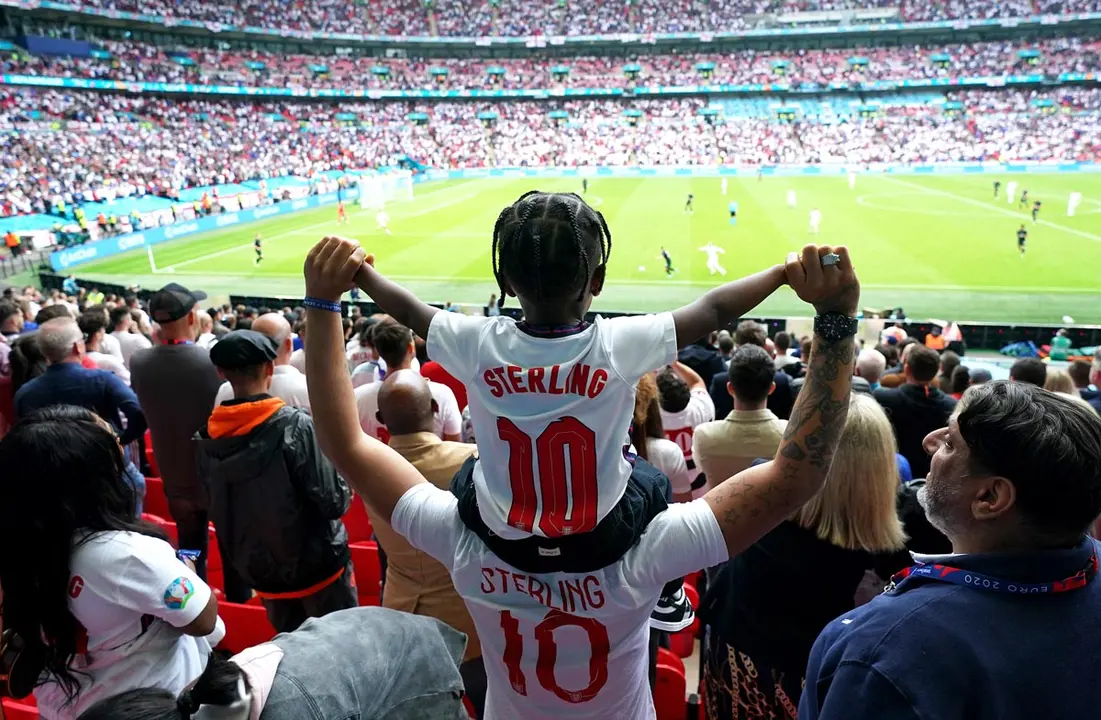29 June 2021, United Kingdom, London: England fans celebrate their side's first goal of the game, scored by England's Raheem Sterling during the UEFA EURO 2020 round of 16 soccer match between England and Germany at Wembley Stadium. Photo: Mike Egerton/PA Wire/dpa