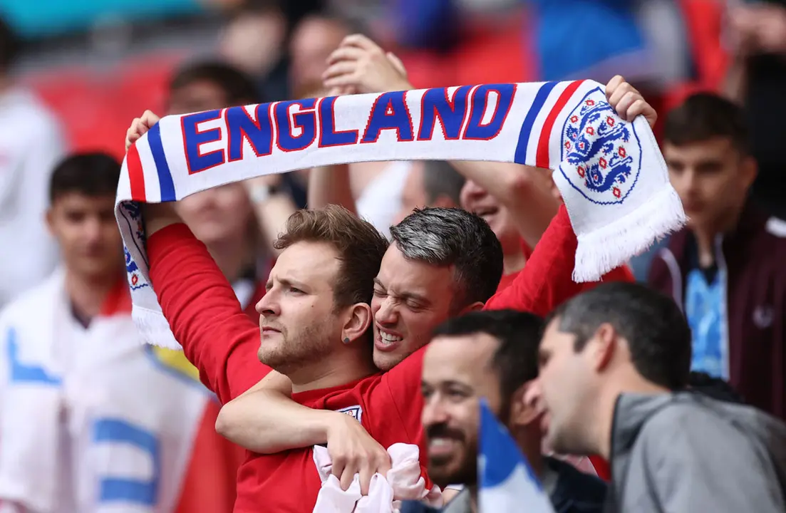 29 June 2021, United Kingdom, London: England fans cheer in the stands prior to the start of the UEFA EURO 2020 round of 16 soccer match between England and Germany at Wembley Stadium. Photo: Christian Charisius/dpa