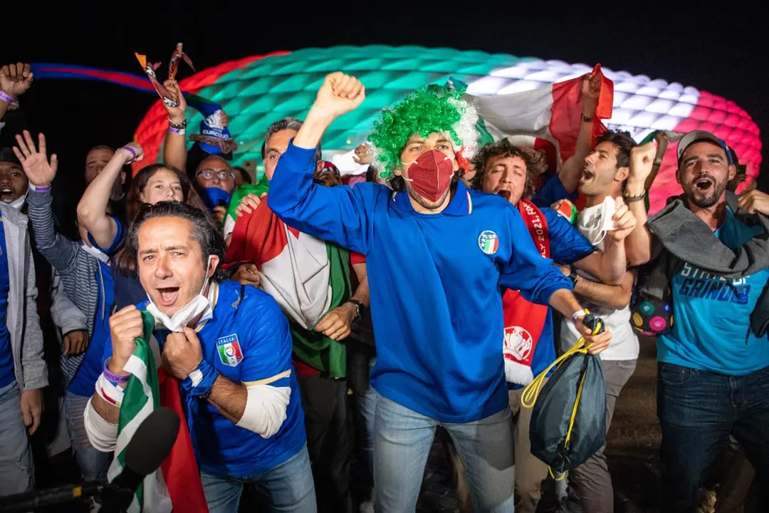 02 July 2021, Bavaria, Munich: Italy fans celebrate outside the hosting venue after the UEFA EURO 2020 quarter-final soccer match between Italy and Belgium at the Allianz Arena. Photo: Matthias Balk/dpa