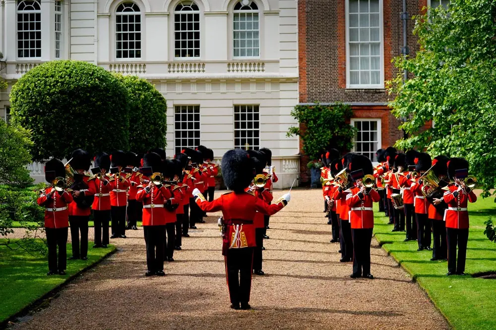 06 July 2021, United Kingdom, London: The Band of the Coldstream Guards plays Three Lions and Sweet Caroline in the gardens of Clarence House in London ahead of England's Euro 2020 semi-final game against Denmark. Three Lions or "Football's Coming Home", is a song by English comedians David Baddiel and Frank Skinner and the rock band the Lightning Seeds. It was released on 20 May 1996, to mark the England football team's hosting of that year's European Championships. Photo: Victoria Jones/PA Wire/dpa