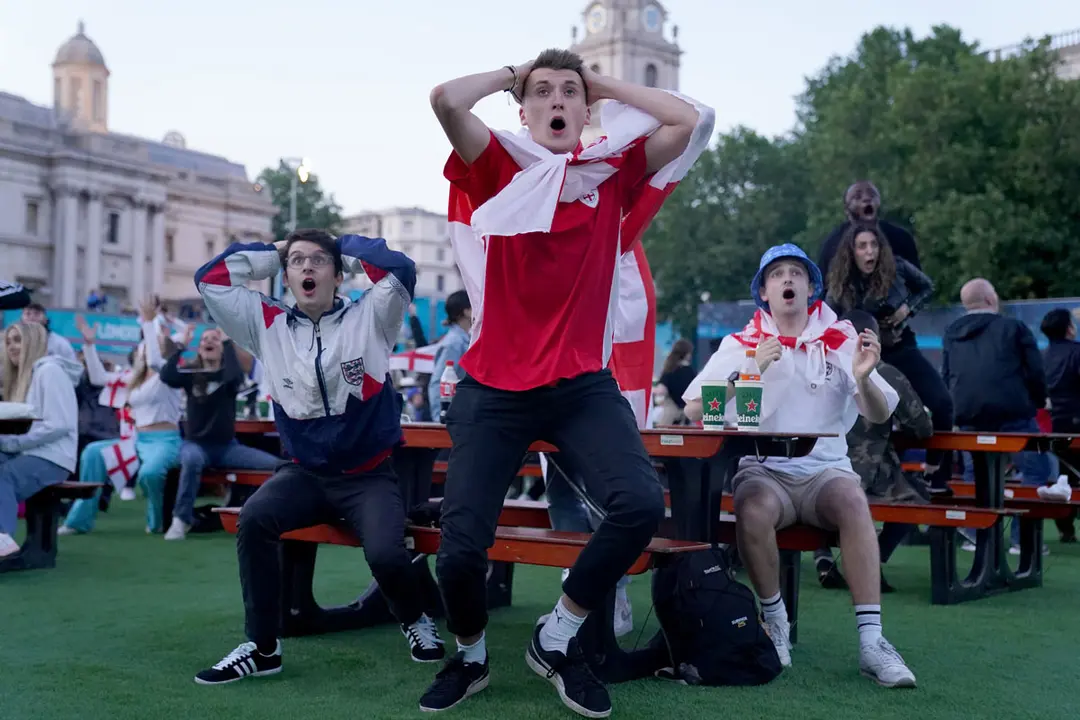 07 July 2021, United Kingdom, London: England fans react at the Vinegar Yard as they watch the UEFA Euro 2020 semi final soccer match between England and Denmark. Photo: Kirsty O'connor/PA Wire/dpa