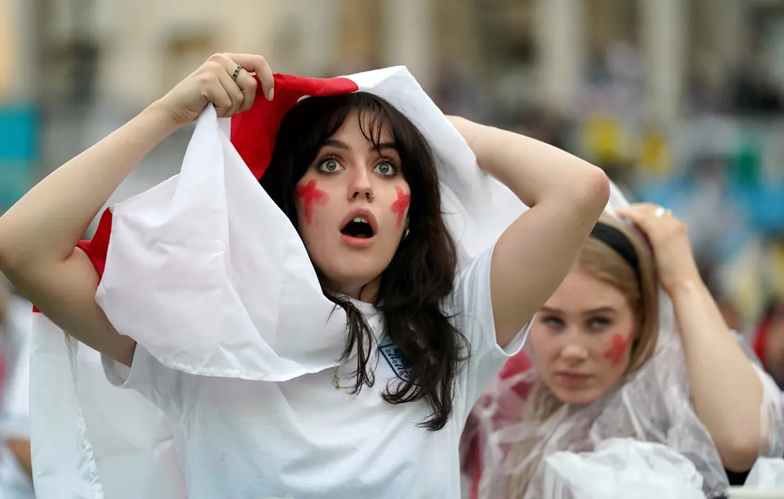 11 July 2021, United Kingdom, London: England fans react at the Trafalgar Square Fan Zone as they watch the UEFA EURO 2020 final soccer match between Italy and England during a public screening for the game. Photo: Andrew Matthews/PA Wire/dpa