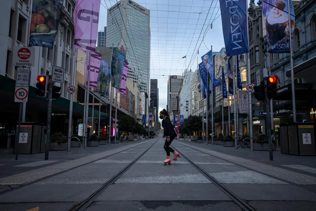 16 July 2021, Australia, Melbourne: A person roller skates across the quiet and deserted Southern Cross Station during the COVID-19 lockdown. Photo: Daniel Pockett/AAP/dpa