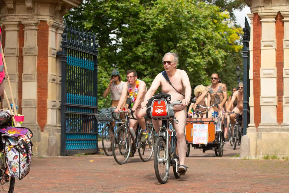 14 August 2021, United Kingdom, London: Cyclists in Victoria Park take part in the World Naked Bike Ride, an environmental pro-bike protest which starts at multiple loactions around the capital and converges in central London. Photo: James Manning/PA Wire/dpa - ATTENTION: graphic content