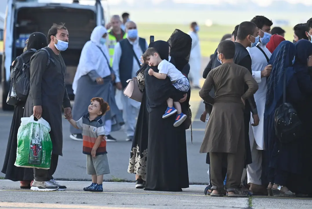24 August 2021, Belgium, Melsbroek: People ride a transport bus upon their arrival on a chartered Air Belgium flight after being evacuated from Afghanistan in the aftermath of the Taliban takeover. Photo: Eric Lalmand/BELGA/dpa