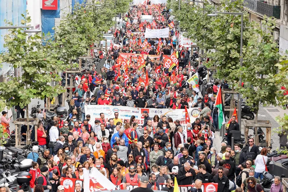 05 October 2021, France, Marseille: Protesters march with flags and banners during a protest called by workers, unemployed and students across France against pension and unemployment insurance reforms at the call of the General Confederation of Labour unions. Photo: Denis Thaust/SOPA Images via ZUMA Press Wire/dpa