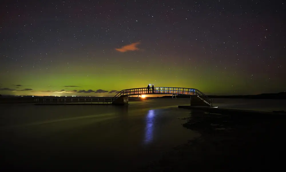 31 October 2021, United Kingdom, Dunbar: The Northern lights form over Belhaven bridge overnight and into the early hours of the day. Photo: Owen Humphreys/PA Wire/dpa.