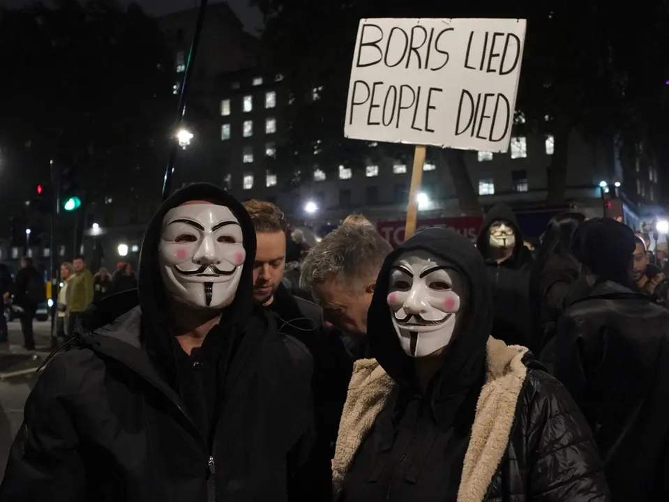 05 November 2021, United Kingdom, London: People take part in the Million Mask March 2021 in Parliament Square. Photo: Yui Mok/PA Wire/dpa.