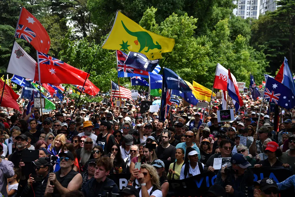 04 December 2021, Australia, Melbourne: People take part in the Eureka Freedom Rally against vaccinations and compulsory vaccinations. Photo: Joel Carrett/AAP/dpa.