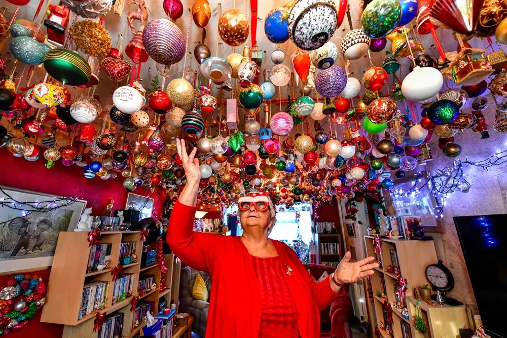 15 December 2021, United Kingdom, London: An undated handout photo, published by Guinness World Records, shows Sylvia Pope, 79 from Swansea, who now holds the record for the largest collection of Christmas bauble ornaments. Photo: Diyan Kantardzhiev/Guinness World Records via PA Media/dpa.