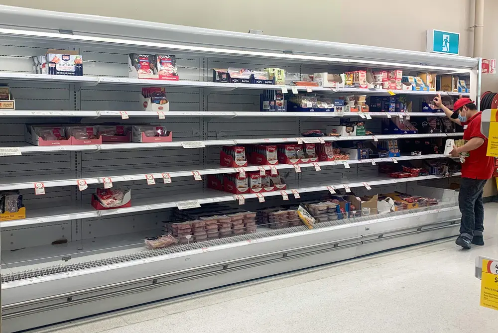 12 January 2022, Australia, Sydney: Empty shelves for delicatessen products are seen at a supermarket in Sydney. The recent spike in COVID-19 infections has caused major logistical disruptions, with staff members, truck drivers and distribution centre workers among those forced to stay at home with the virus or awaiting test results. Photo: Bianca De Marchi/AAP/dpa.