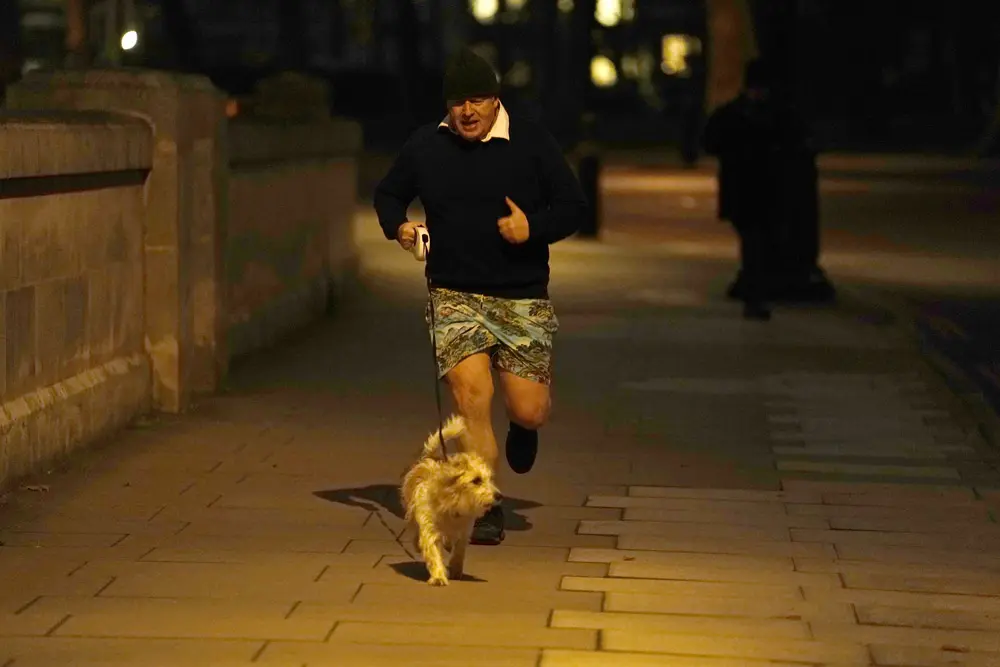 24 January 2022, United Kingdom, London: UK Prime Minister Boris Johnson jogs in central London. Johnson is under mounting pressure to hold an inquiry into claims junior minister Nusrat Ghani was sacked because of her "Muslimness" after a second Cabinet minister called for an investigation. Photo: Aaron Chown/PA Wire/dpa.