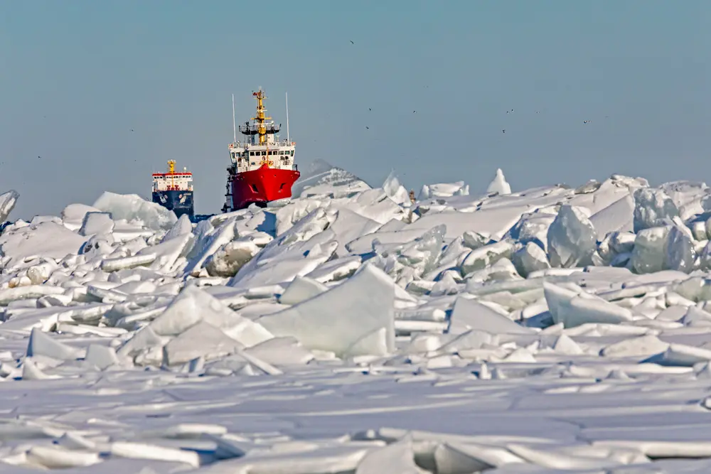 26 January 2022, US, Detroit: The Canadian Coast Guard vessel Samuel Risley leads the Algocanada, an oil/chemical tanker, through ice on Lake St. Clair as they enter the Detroit River. Cold weather in the region has created ice jams and caused shipping problems in some locations. Photo: Jim West/ZUMA Press Wire/dpa.