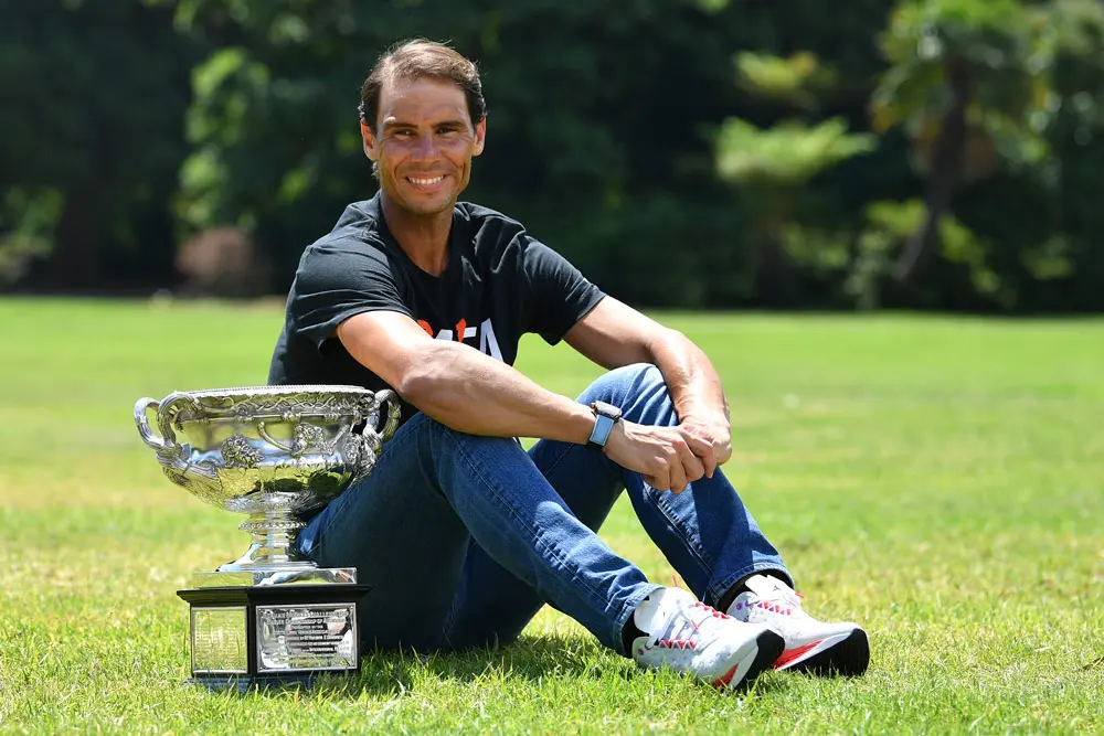 31 January 2022, Australia, Melbourne: Spanish tennis player Rafael Nadal poses with the Norman Brookes Challenge Cup. Nadal won a record 21st Grand Slam and his second Australian Open title on Sunday after a thrilling five set victory over Russia's Daniil Medvedev. Photo: Joel Carrett/AAP/dpa.