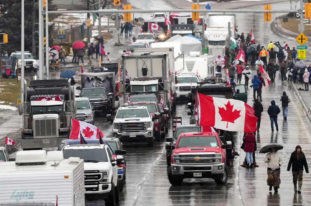 11 February 2022, Canada, Windsor: Truckers and supporters block the access leading from the Ambassador Bridge, linking Detroit and Windsor, as truckers and their supporters continue to protest against COVID-19 vaccine mandates and restrictions. Photo: Nathan Denette/Canadian Press via ZUMA Press/dpa.